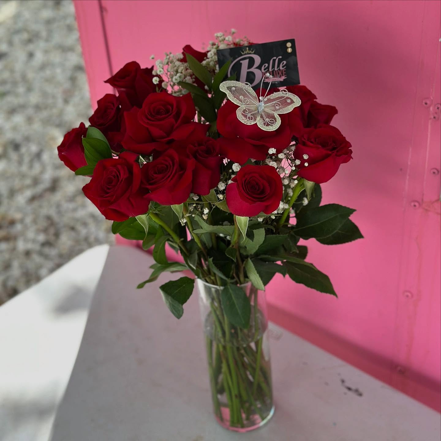 24 red roses on a vase