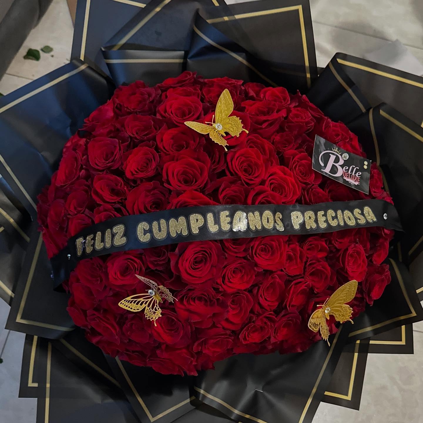 100 Red roses on black paper