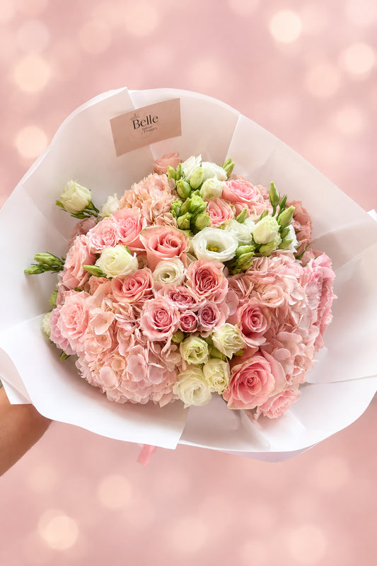 Hand-tied pink hydrangea, rose, and lisianthus mixed bouquet