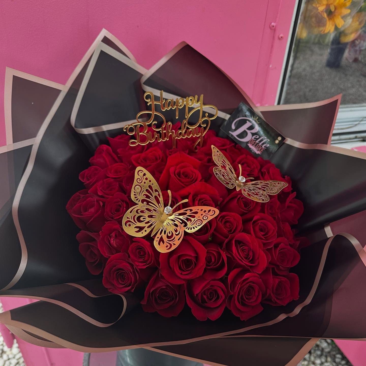 50 red roses on black paper